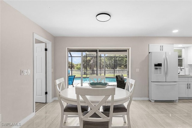 3823 Palm Tree Blvd, Cape Coral, FL 33904 - dining space with baseboards and recessed lighting
