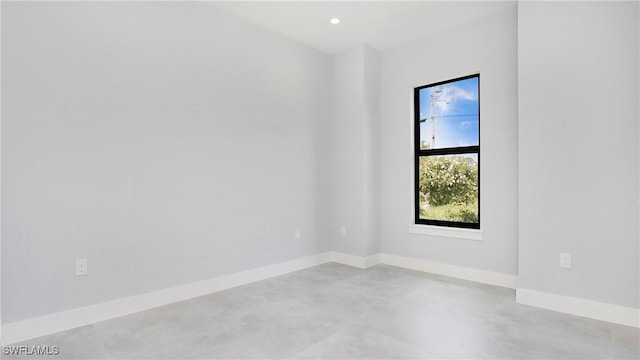 739 David Laird Ln, Lehigh Acres, FL 33974 - spare room featuring finished concrete flooring and baseboards
