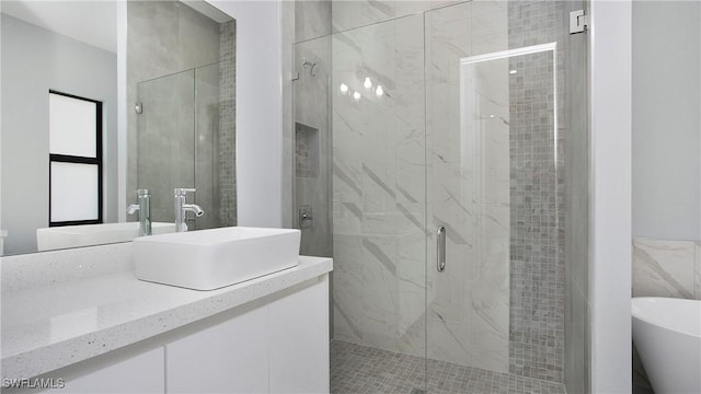 739 David Laird Ln, Lehigh Acres, FL 33974 - bathroom with a shower stall, a soaking tub, and vanity