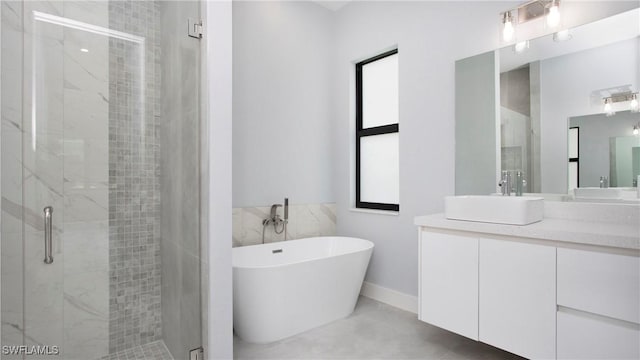 739 David Laird Ln, Lehigh Acres, FL 33974 - bathroom with a marble finish shower, vanity, and a soaking tub