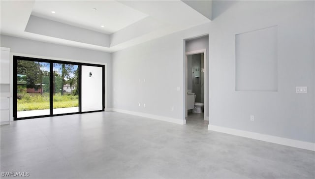739 David Laird Ln, Lehigh Acres, FL 33974 - unfurnished room with concrete floors and a raised ceiling