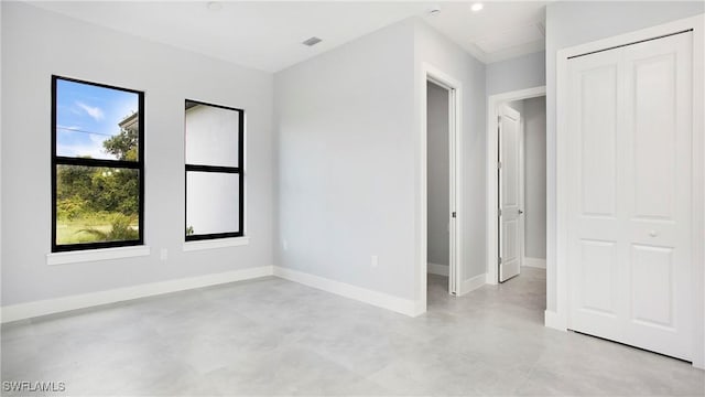 739 David Laird Ln, Lehigh Acres, FL 33974 - empty room with finished concrete floors and baseboards