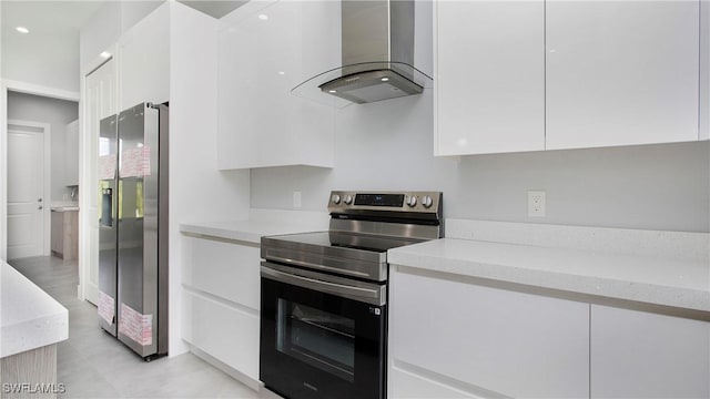739 David Laird Ln, Lehigh Acres, FL 33974 - kitchen with exhaust hood, stainless steel appliances, white cabinetry, and modern cabinets