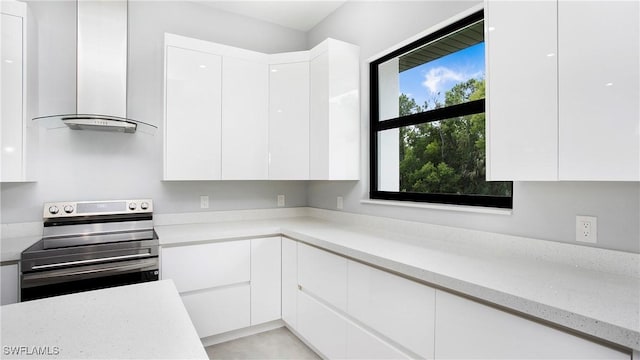 739 David Laird Ln, Lehigh Acres, FL 33974 - kitchen featuring stainless steel electric range, modern cabinets, island exhaust hood, white cabinetry, and light stone countertops