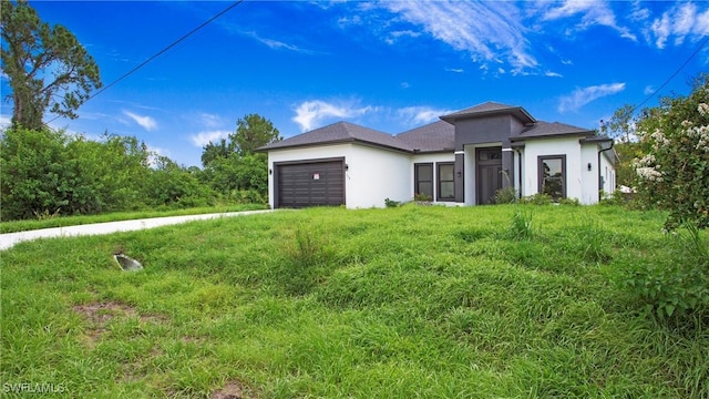 739 David Laird Ln, Lehigh Acres, FL 33974 - view of front of property featuring stucco siding and a garage
