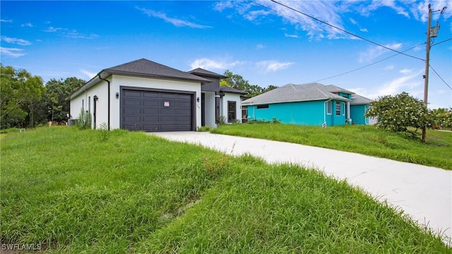 739 David Laird Ln, Lehigh Acres, FL 33974 - ranch-style house with driveway, a garage, stucco siding, and a front lawn