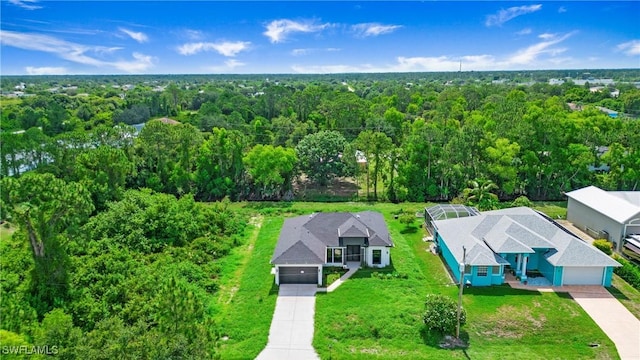 739 David Laird Ln, Lehigh Acres, FL 33974 - aerial view of property and surrounding area featuring a forest