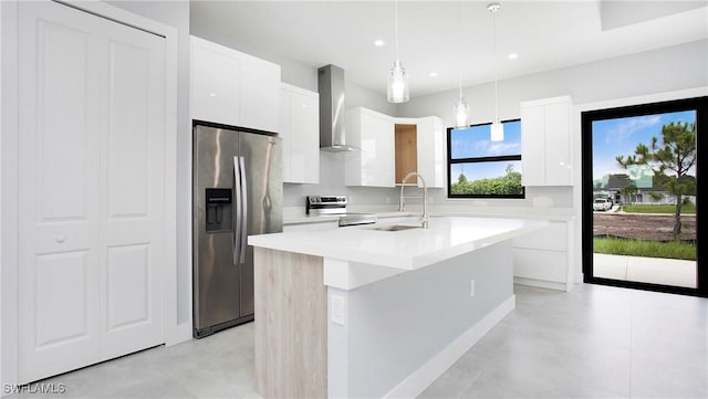 766 Naples Ave S, Lehigh Acres, FL 33974 - kitchen featuring stainless steel appliances, wall chimney exhaust hood, modern cabinets, white cabinets, and a center island with sink