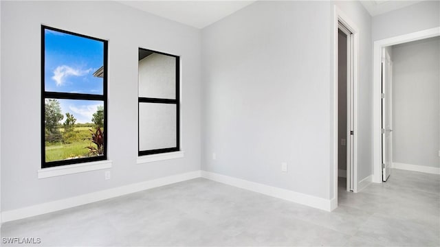 766 Naples Ave S, Lehigh Acres, FL 33974 - spare room featuring concrete floors