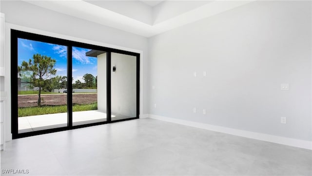 766 Naples Ave S, Lehigh Acres, FL 33974 - unfurnished room with baseboards and finished concrete flooring