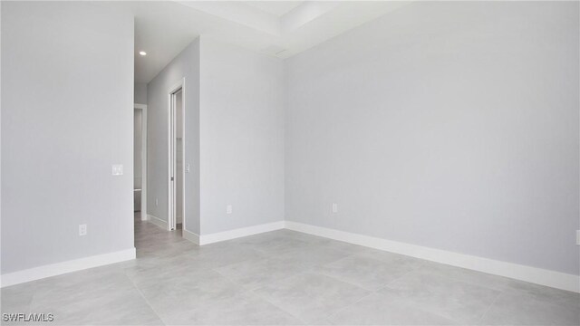 766 Naples Ave S, Lehigh Acres, FL 33974 - empty room featuring finished concrete flooring and recessed lighting