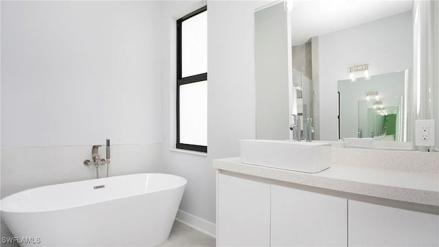 766 Naples Ave S, Lehigh Acres, FL 33974 - bathroom featuring a soaking tub and vanity