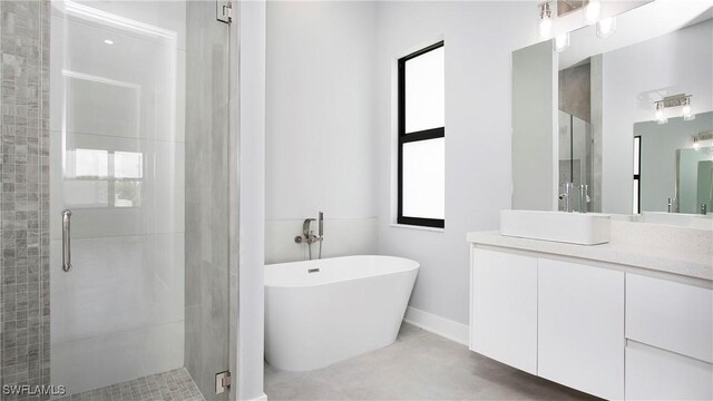 766 Naples Ave S, Lehigh Acres, FL 33974 - bathroom featuring a stall shower, vanity, and a freestanding tub