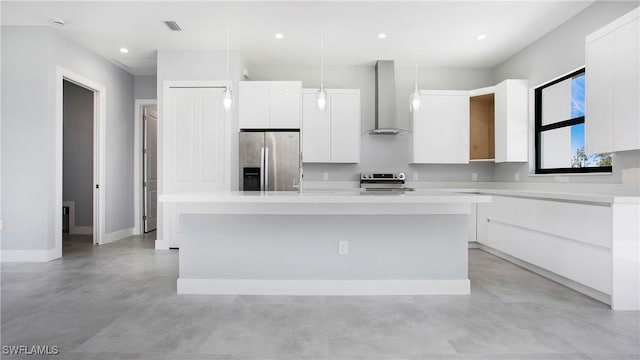 766 Naples Ave S, Lehigh Acres, FL 33974 - kitchen with wall chimney exhaust hood, appliances with stainless steel finishes, concrete floors, modern cabinets, and a kitchen island with sink