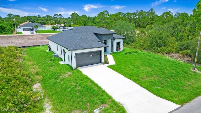 766 Naples Ave S, Lehigh Acres, FL 33974 - view of front facade featuring a garage, concrete driveway, a front yard, stucco siding, and a shingled roof