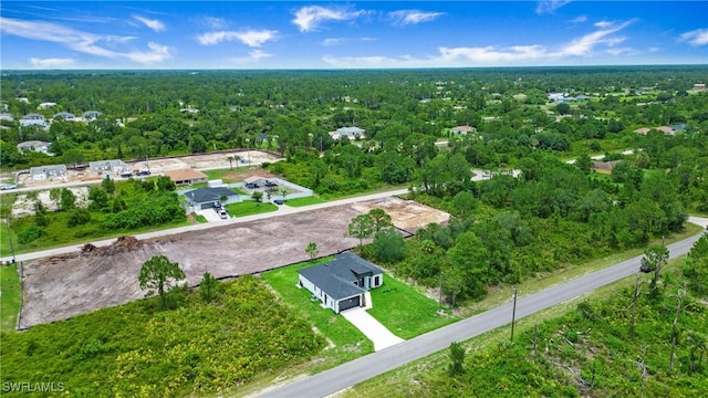766 Naples Ave S, Lehigh Acres, FL 33974 - aerial view of property and surrounding area with a forest