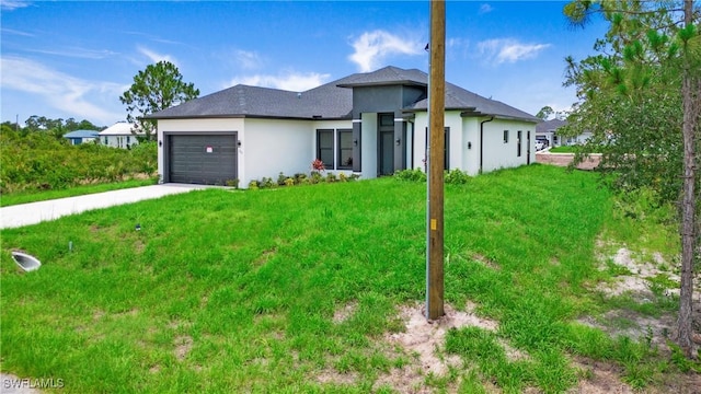 766 Naples Ave S, Lehigh Acres, FL 33974 - view of front of home featuring a garage, concrete driveway, stucco siding, and a front yard