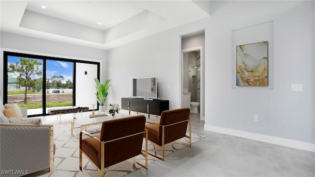 766 Naples Ave S, Lehigh Acres, FL 33974 - living room with concrete floors and a tray ceiling