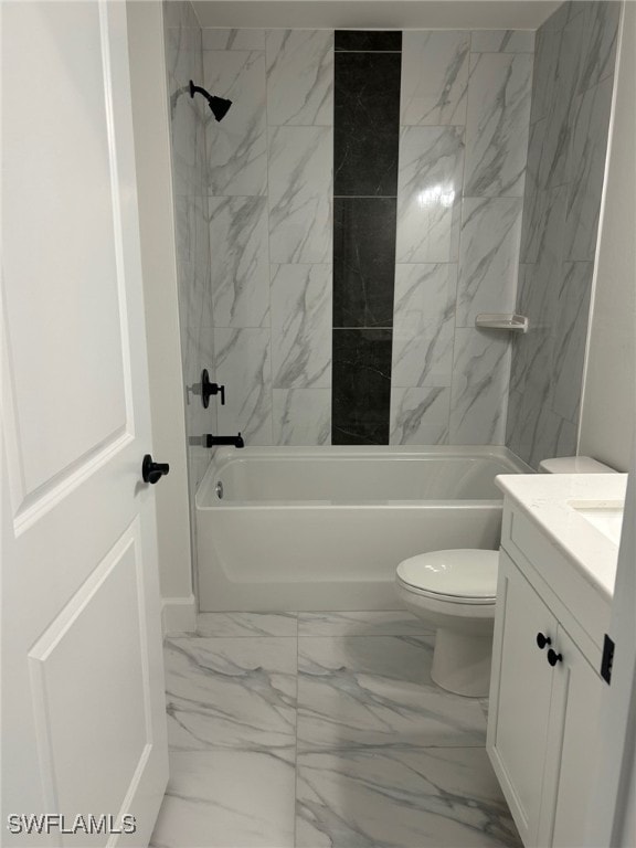 700 Avondale St E, Lehigh Acres, FL 33974 - full bathroom featuring marble finish flooring, vanity, and shower / tub combination