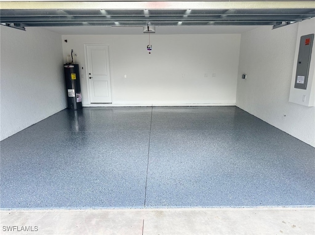 700 Avondale St E, Lehigh Acres, FL 33974 - garage with electric water heater, electric panel, and a garage door opener
