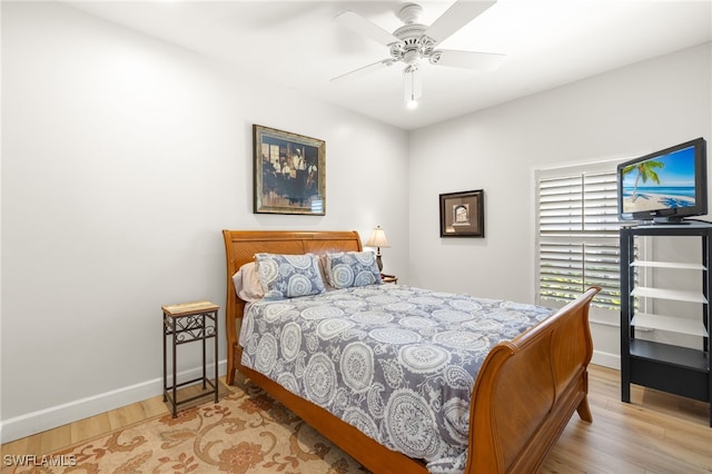 23204 Coconut Shores Dr, Estero, FL 34134 - bedroom featuring light wood finished floors and a ceiling fan
