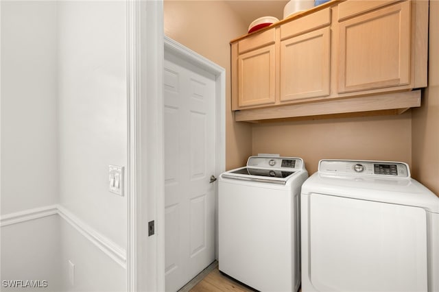 23204 Coconut Shores Dr, Estero, FL 34134 - washroom featuring cabinet space, washer and dryer, and light wood-style floors