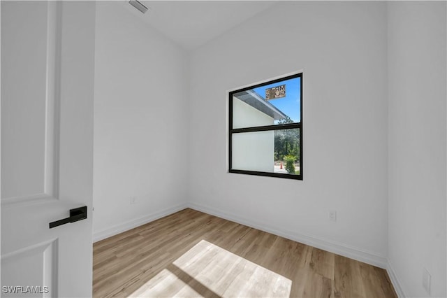 1517 Washington Ave, Lehigh Acres, FL 33972 - spare room featuring wood finished floors and baseboards