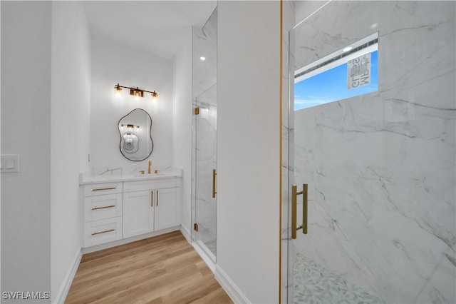 1517 Washington Ave, Lehigh Acres, FL 33972 - bathroom with vanity, a marble finish shower, and wood finished floors