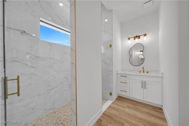 1517 Washington Ave, Lehigh Acres, FL 33972 - full bathroom with a marble finish shower, vanity, and wood finished floors