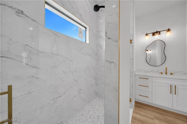 1517 Washington Ave, Lehigh Acres, FL 33972 - bathroom with vanity, a marble finish shower, and wood finished floors