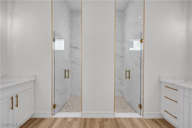 1517 Washington Ave, Lehigh Acres, FL 33972 - full bathroom featuring vanity, a marble finish shower, and wood finished floors