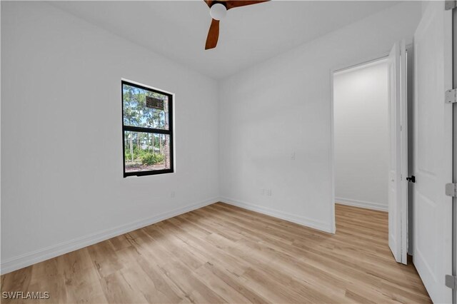 1517 Washington Ave, Lehigh Acres, FL 33972 - empty room featuring light wood finished floors and ceiling fan