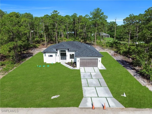 1517 Washington Ave, Lehigh Acres, FL 33972 - view of front of house featuring a front lawn, driveway, stucco siding, an attached garage, and a view of trees