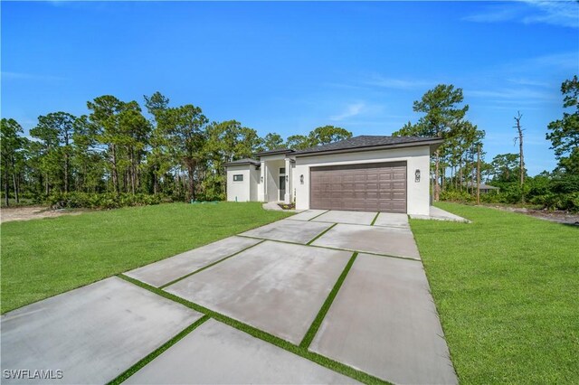 1517 Washington Ave, Lehigh Acres, FL 33972 - view of front facade with stucco siding, driveway, a garage, and a front yard