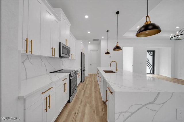 1517 Washington Ave, Lehigh Acres, FL 33972 - kitchen featuring appliances with stainless steel finishes, recessed lighting, white cabinetry, backsplash, and light wood-type flooring