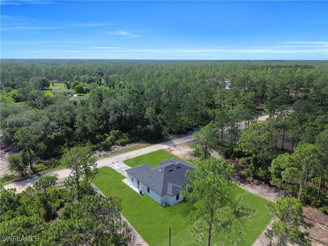 1517 Washington Ave, Lehigh Acres, FL 33972 - view of subject property featuring a forest
