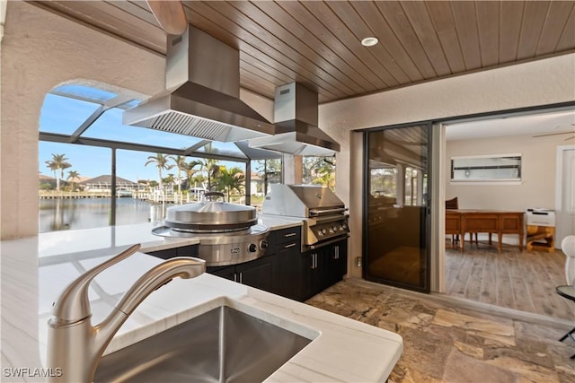 1701 Casey Key Dr, Punta Gorda, FL 33950 - view of patio with a water view and exterior kitchen