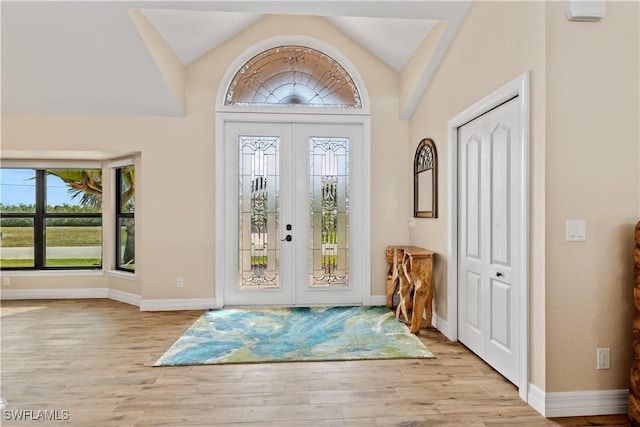 1701 Casey Key Dr, Punta Gorda, FL 33950 - entrance foyer with french doors, wood finished floors, and vaulted ceiling
