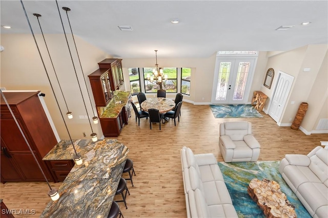 1701 Casey Key Dr, Punta Gorda, FL 33950 - living area featuring light wood-type flooring, a chandelier, and recessed lighting