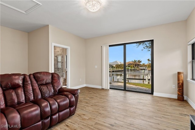 1701 Casey Key Dr, Punta Gorda, FL 33950 - living area featuring light wood-style floors and a water view