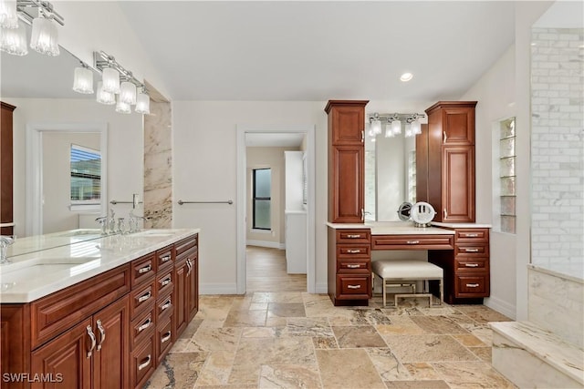 1701 Casey Key Dr, Punta Gorda, FL 33950 - bathroom featuring double vanity, stone tile floors, and recessed lighting
