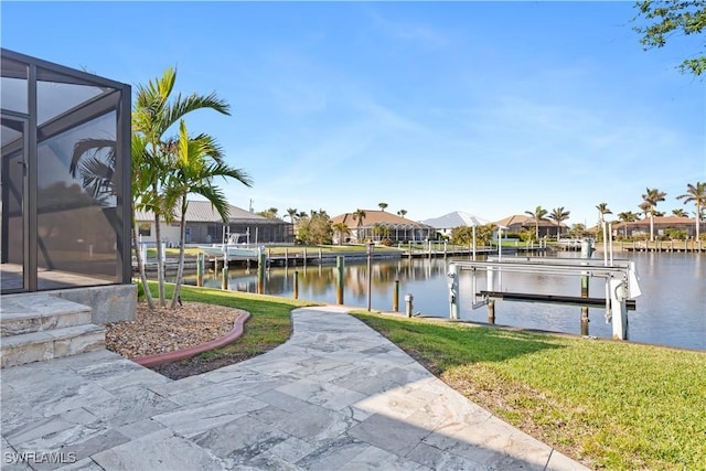 1701 Casey Key Dr, Punta Gorda, FL 33950 - dock area featuring boat lift, a residential view, a water view, and a yard