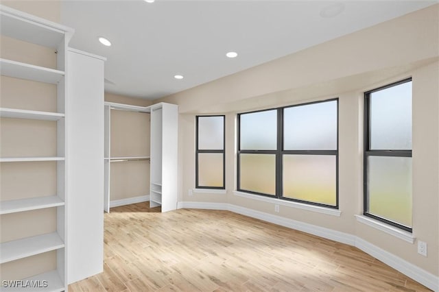 1701 Casey Key Dr, Punta Gorda, FL 33950 - unfurnished bedroom with wood finished floors and recessed lighting