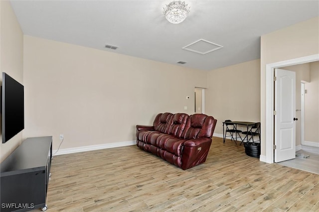 1701 Casey Key Dr, Punta Gorda, FL 33950 - living room featuring attic access and light wood finished floors