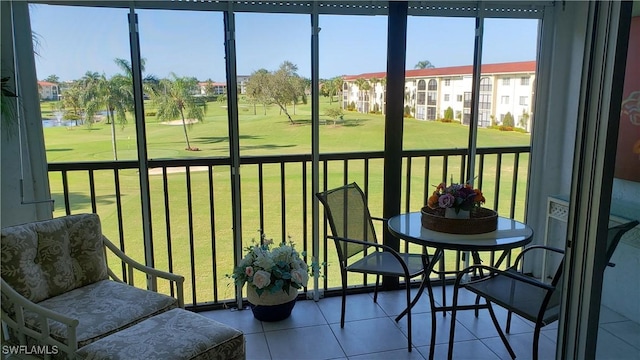 21 High Point Cir E Unit 308, Naples, FL 34103 - sunroom / solarium featuring view of golf course