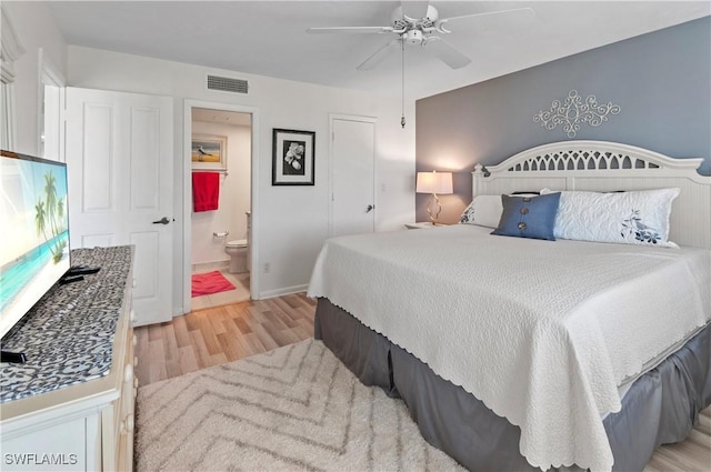 21 High Point Cir E Unit 308, Naples, FL 34103 - bedroom featuring light wood finished floors, ensuite bathroom, and a ceiling fan