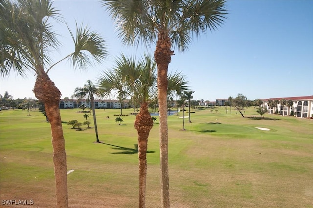 21 High Point Cir E Unit 308, Naples, FL 34103 - surrounding community with a yard and view of golf course