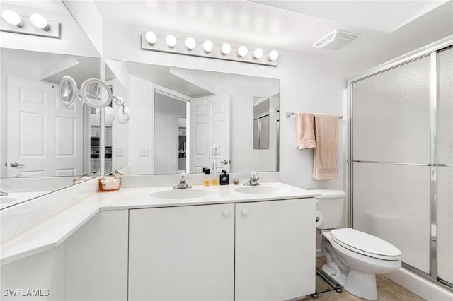 4945 Cougar Ct S Unit 4-202, Naples, FL 34109 - full bathroom with double vanity and a shower stall