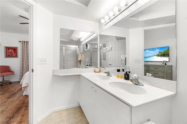 4945 Cougar Ct S Unit 4-202, Naples, FL 34109 - bathroom with double vanity and a shower
