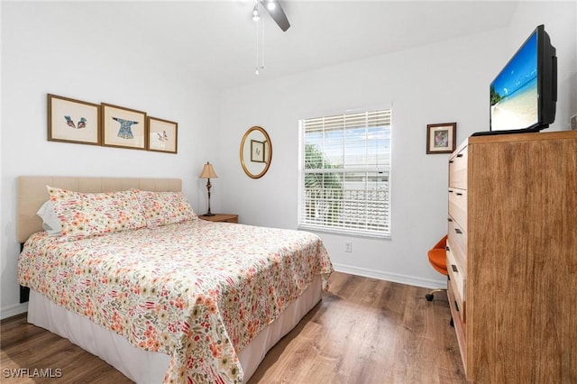 4945 Cougar Ct S Unit 4-202, Naples, FL 34109 - bedroom with wood finished floors and ceiling fan